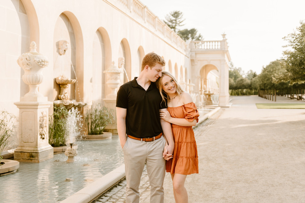 couple in garden for engagement pictures