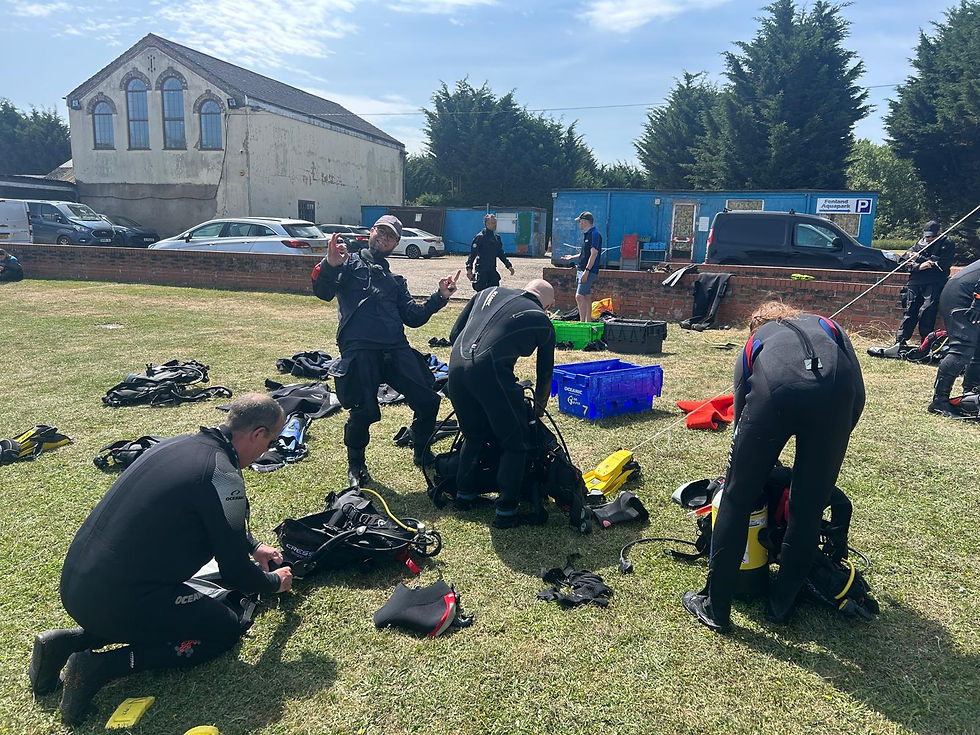 High angle view of a diver preparing for an open water dive on a boat