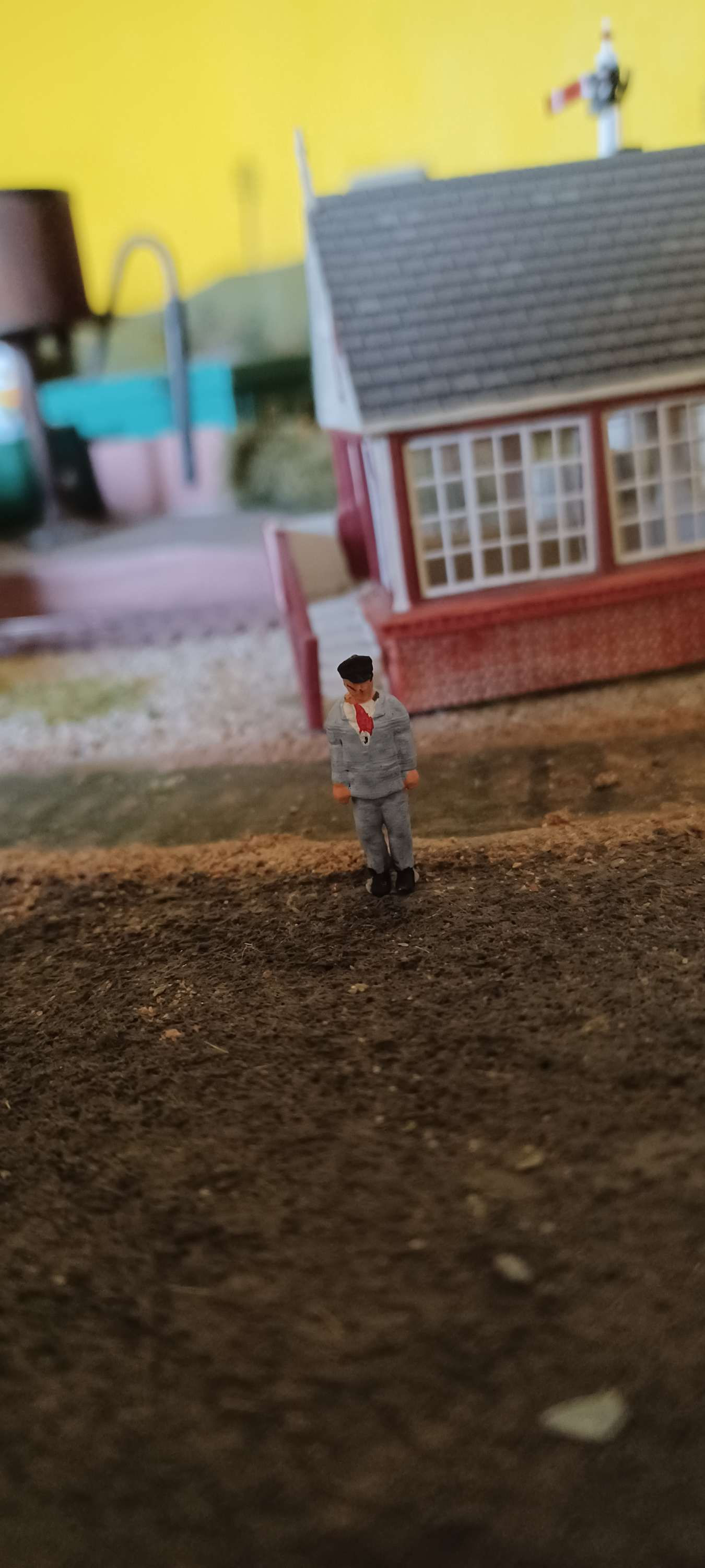 Fig: OO18 OO Gauge painted loco crew member with arms by his side 