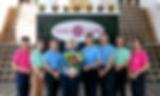 Doris Knecht, Head of Care at VivoCare, standing with her lead staff team in front of the VivoCare sign, showcasing their commitment to western care standards and Thai hospitality.