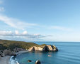 coastal landscape background with only #4995a8 and #768910 and #f4eada as color palette.jpg
