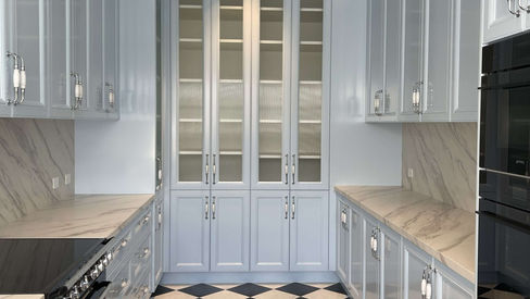 Black and white tiled hallway with detailed wall panelling at Crawford Creek House
