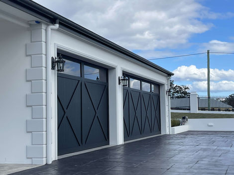 crawford creek house luxury new acerage home white garage black barn doors black driveway