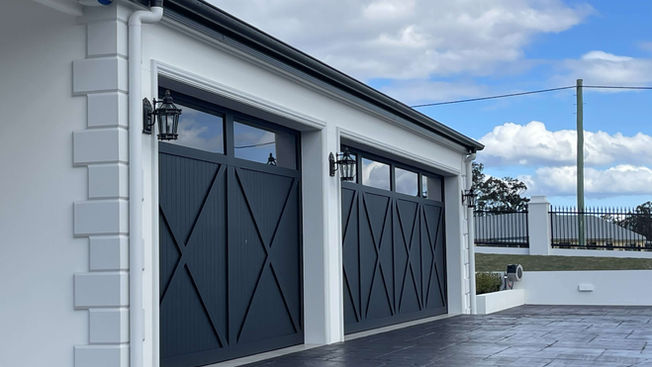 crawford creek house luxury new acerage home white garage black barn doors black driveway