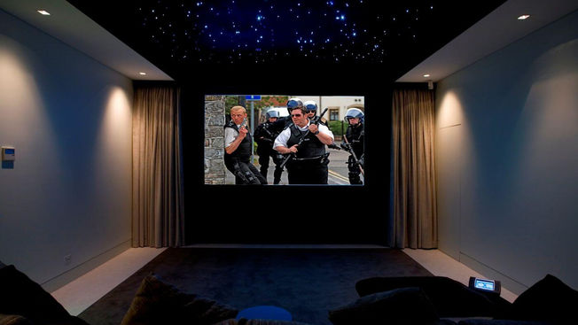 Dedicated home cinema with star-effect ceiling at Portrush House