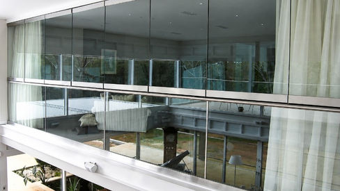 Upper-level master suite balcony and glass balustrade at Hidden Valley House
