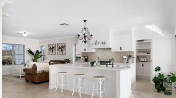 River Road Villa Extension Renovation white kitchen beige tiles black chandelier