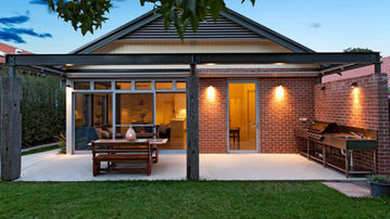 Rear elevation and outdoor entertaining area at Creewood House in Concord NSW