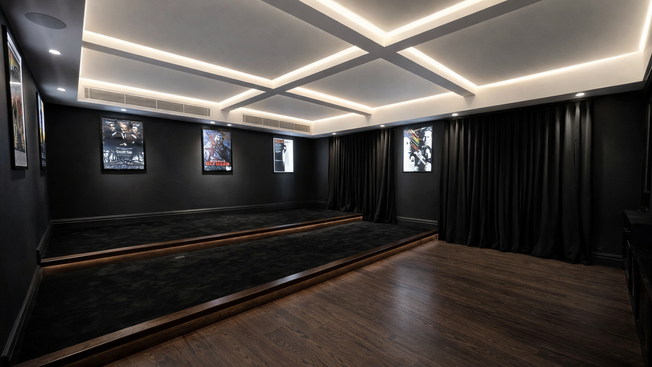 Home theatre room with dark interior finishes at Crawford Creek House