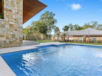 Beecroft Custom New Home Design pool with water feature and stacked stone wall