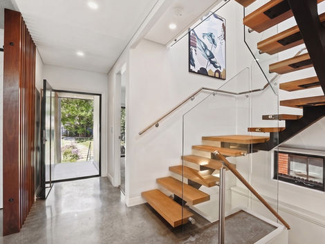 WHEELER HEIGHTS House custom home design by Distinct Innovations Architectural Drafting exposed spine staircase with timber dividing columns