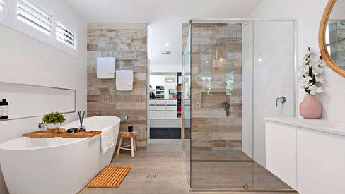 Ensuite bathroom with freestanding bath, double vanity and frameless glass shower at Blaxland House