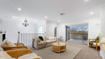 Light-filled family living area overlooking the Nepean River at River Road Villa House