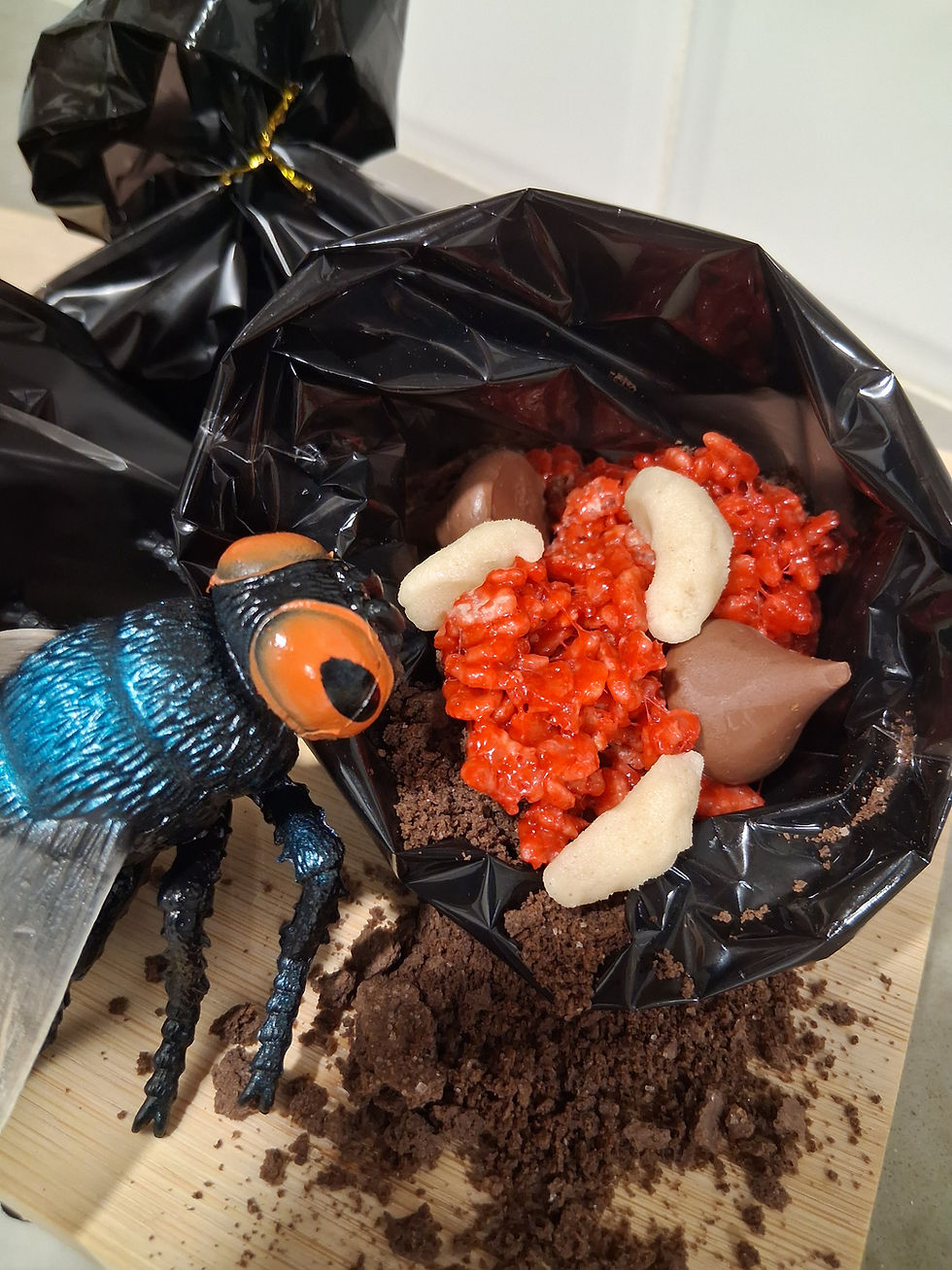 Kid's food craft made to look like maggot food in a treat bag