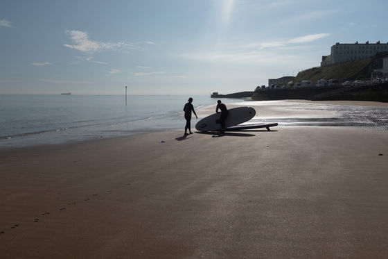 paddleboarders on the beach
