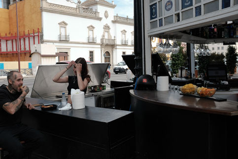 A guy eating tapas at a bar in Seville.