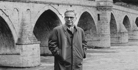 Ivo Andric standing by the Bridge over the Drina