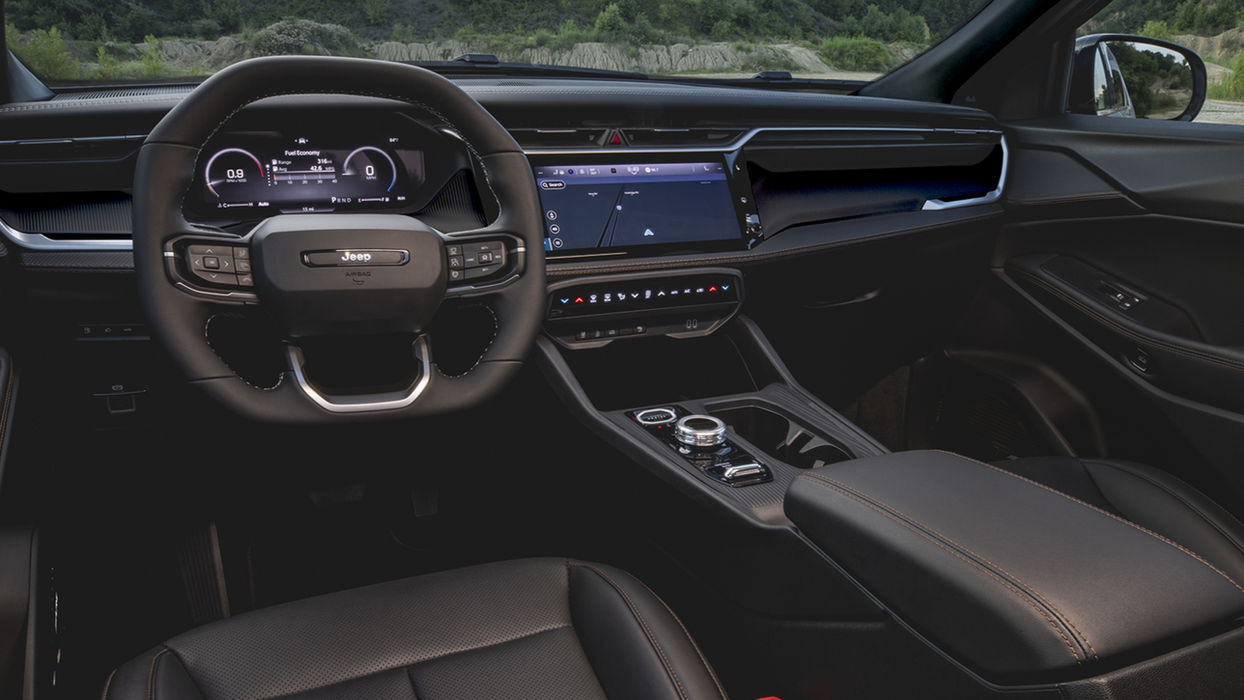 Interior dashboard and steering wheel of a Jeep Cherokee