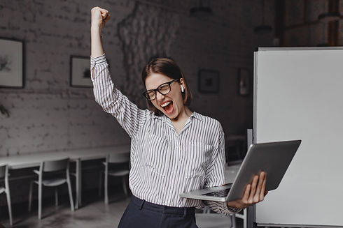 business-woman-with-laptop-in-hand-is-happy-with-success-portrait-of-woman-in-glasses-and-