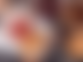 A table with a peanut butter and jelly sandwich being prepared