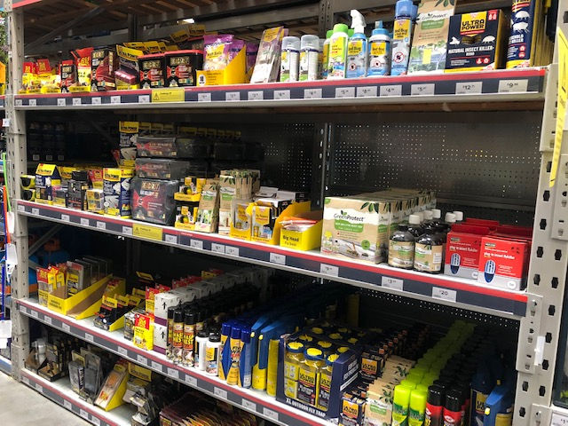 DIY pest control products on a shelf in a well known hardware retailer