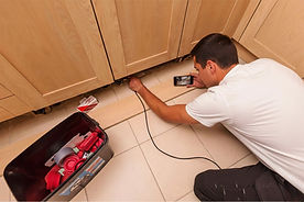 award winning pest control technician at PGM conducting a pest inspection using state-of-the-art equipment