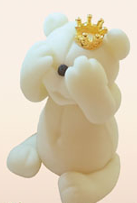 Thumbnail: Adorable white fondant bear figurine wearing a golden crown