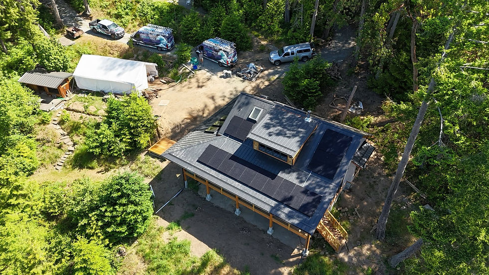Oceanvolt’s EV fleet in front of a solar house on Thetis Island.