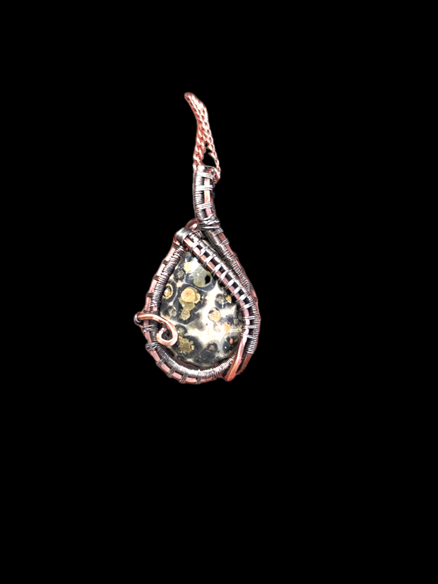 Dainty teardrop Leopardskin Jasper stone wrapped in silver and copper wire.