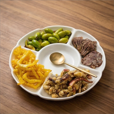 Platter with edamame, sliced meat, fried snacks, and fried seafood