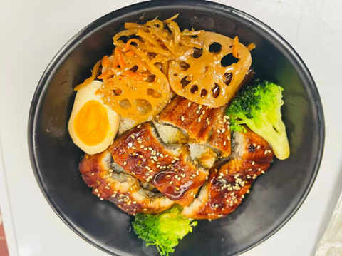 Grilled eel rice bowl with egg, lotus root, and broccoli