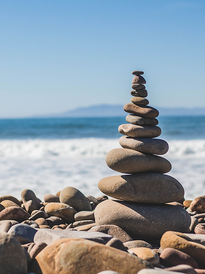 Stacked stones by ocean