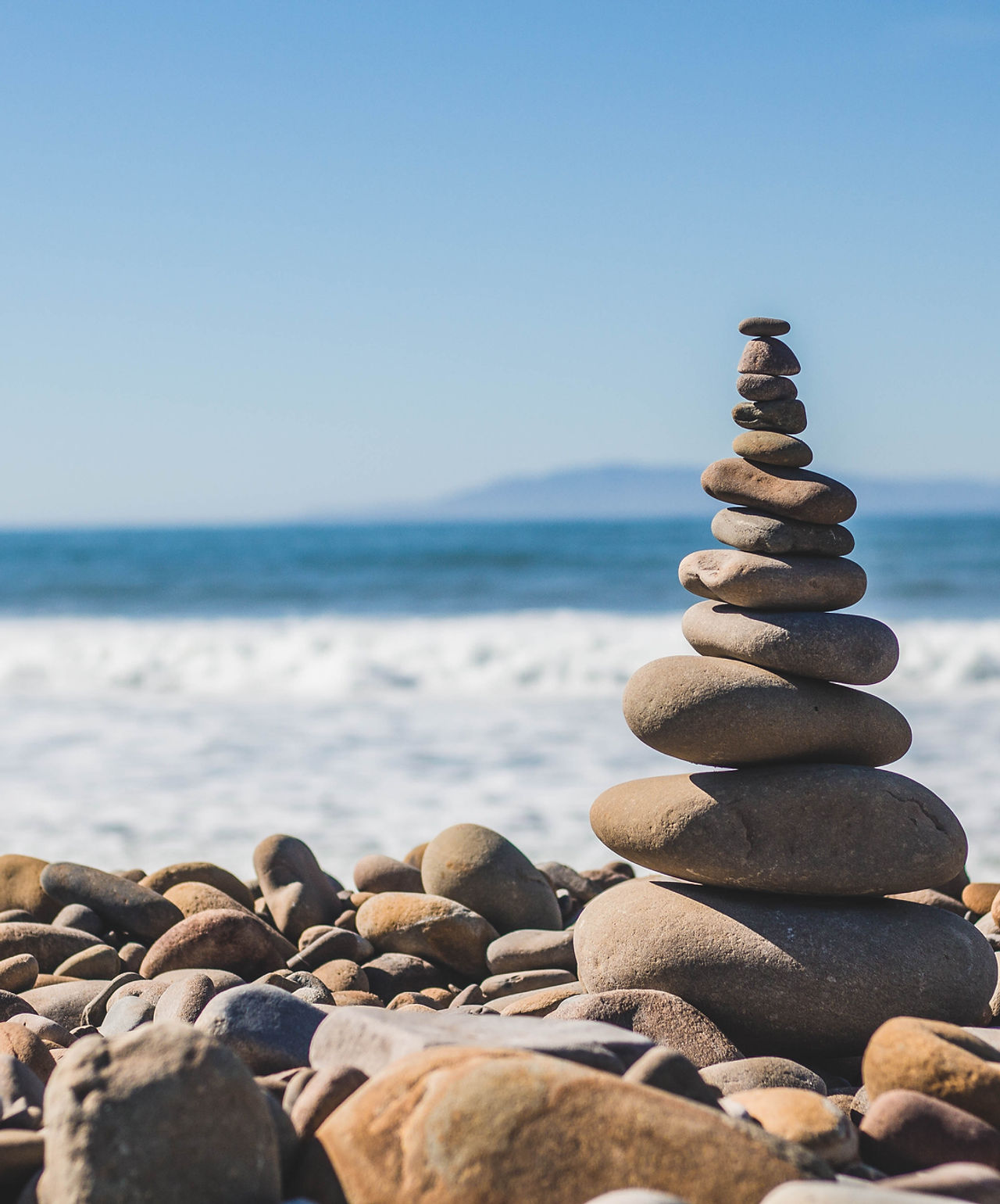 Stacked stones by ocean