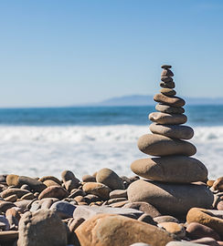 Stacked stones by ocean