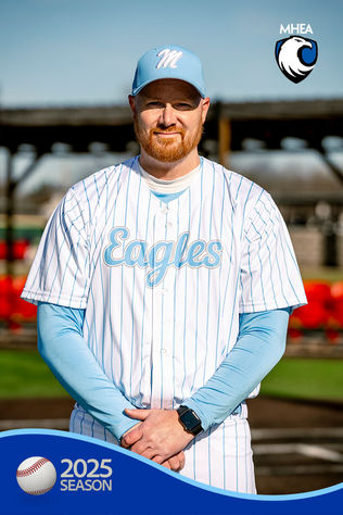 Assistant Coach standing on a baseball field.