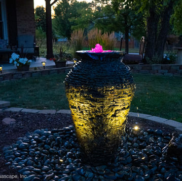 Single stacked slate urn fountain brought to life by Aquascape color changing lights