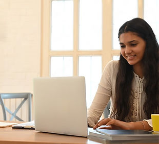 university-student-is-learning-lessons-online-while-sitting-wooden-working-desk_35674-2660