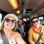 happy tourist inside RSN Tour bus Vehicl