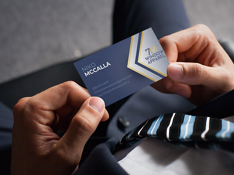mockup-of-a-man-holding-a-business-card-with-an-embossed-texture-33770.png