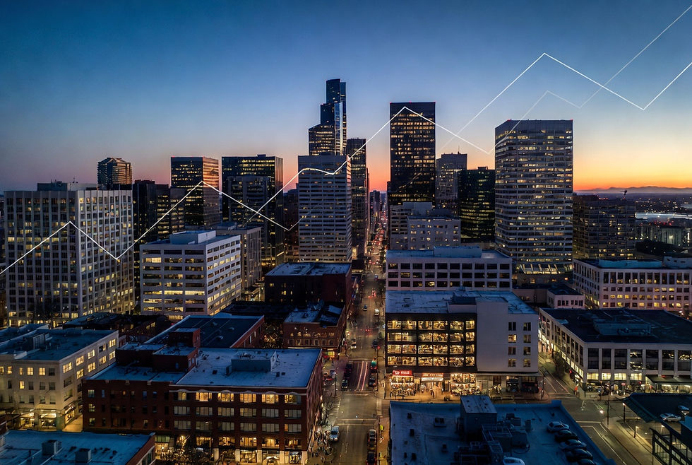 Aerial view of Portland downtown skyline at dusk highlighting office vacancies, emerging street activity, and broader economic outlook.