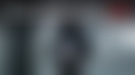 Oregon landlord holding right of entry notice at rental property door in Portland winter setting.