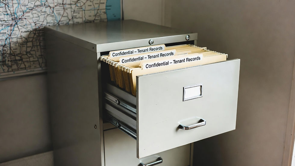 Secure filing cabinet holding confidential tenant records in Oregon rental office.
