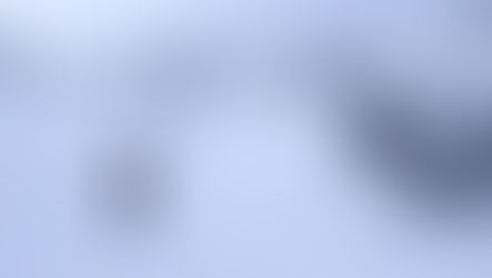 A backcountry skier touring uphill in the Kendall zone, near Snoqualmie Pass, Washington.