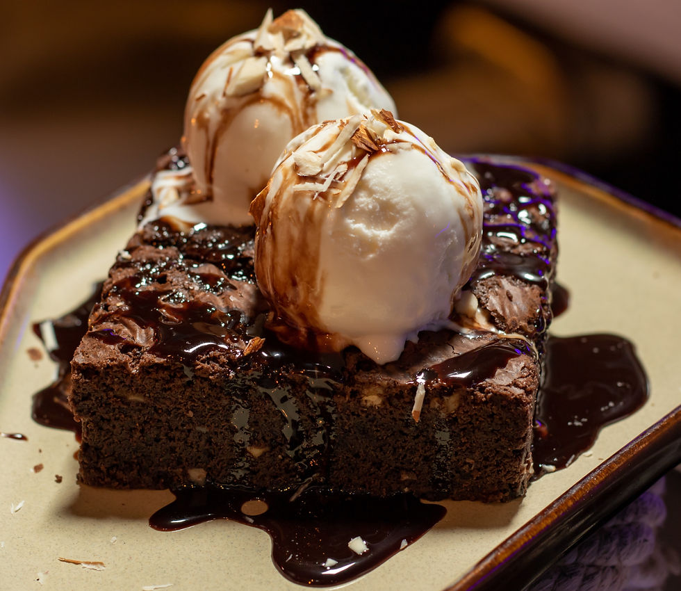 chocolate brownie with white icing on white choc truffle