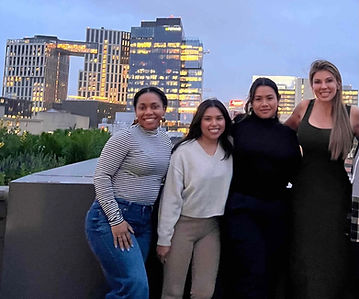 A diverse group of therapists gathered on a rooftop in Bethesda, overlooking the skyline as the day winds down. 
