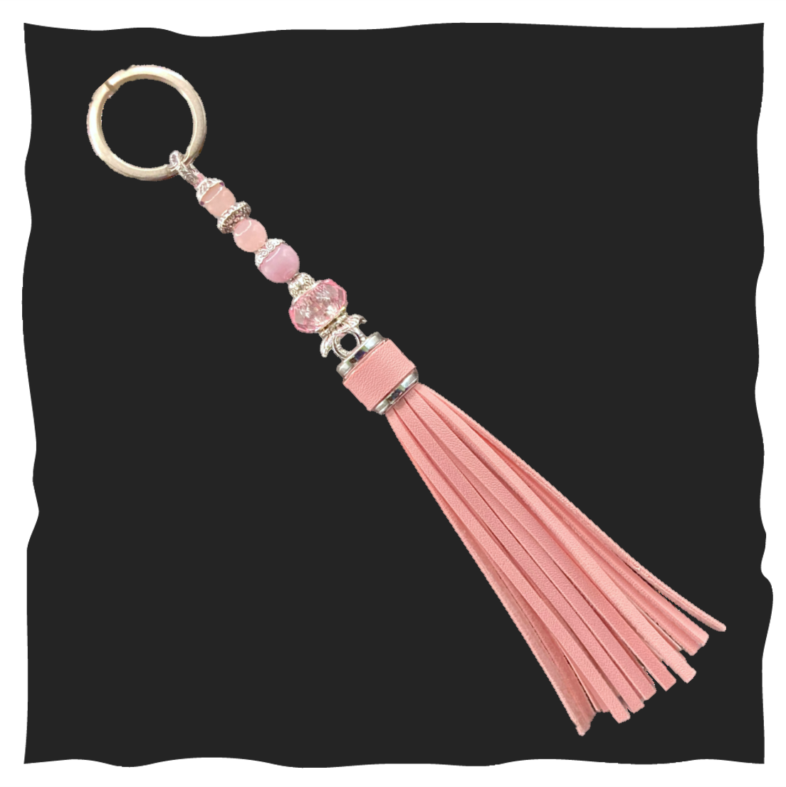 Schlüsselanhänger mit rosa Quaste 