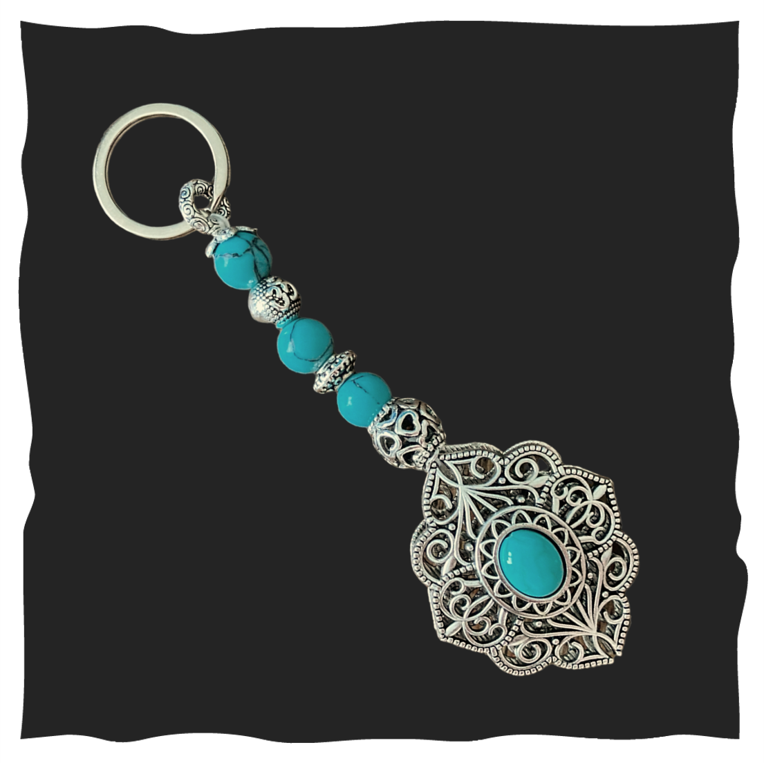 Schlüsselanhänger türkis mit grosser silbernen Blume 