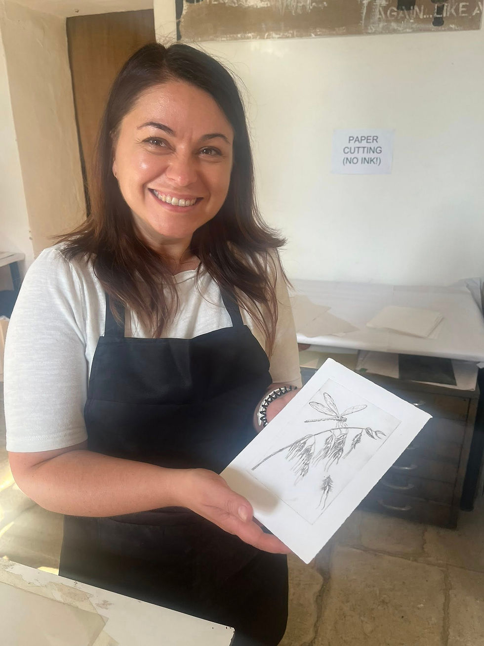 A happy participant showing her first drypoint proof.