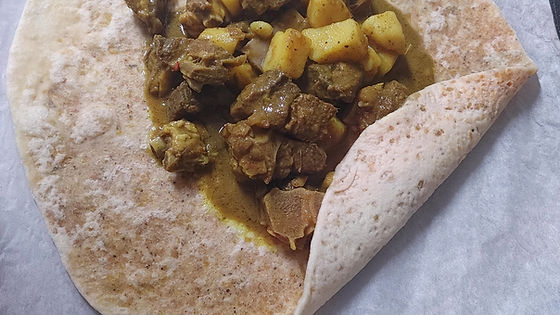 CURRY GOAT (Bones-in-meat) ROTI