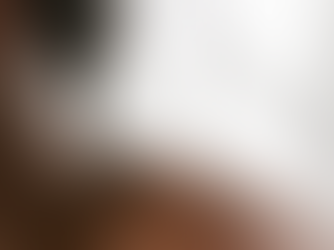 Close-up of a person's shoulder with acupuncture needles inserted. Soft lighting creates a calm atmosphere.